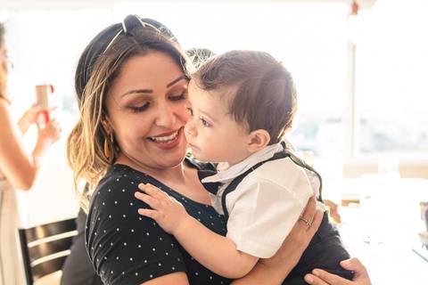 madrinha com bebê no colo'