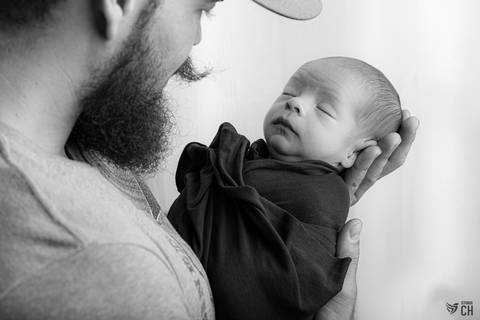 Newborn com pais'