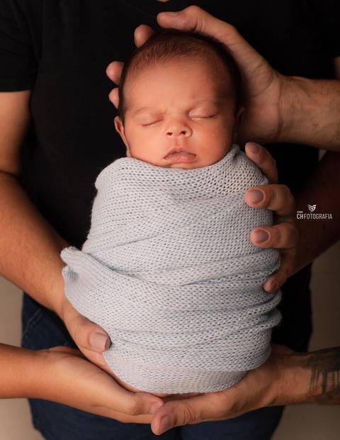 Newborn com os pais '