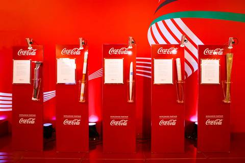 Exposição de Tochas Olímpicas no estande da Coca Cola em fotografia corporativa em Londrina-Pr.'