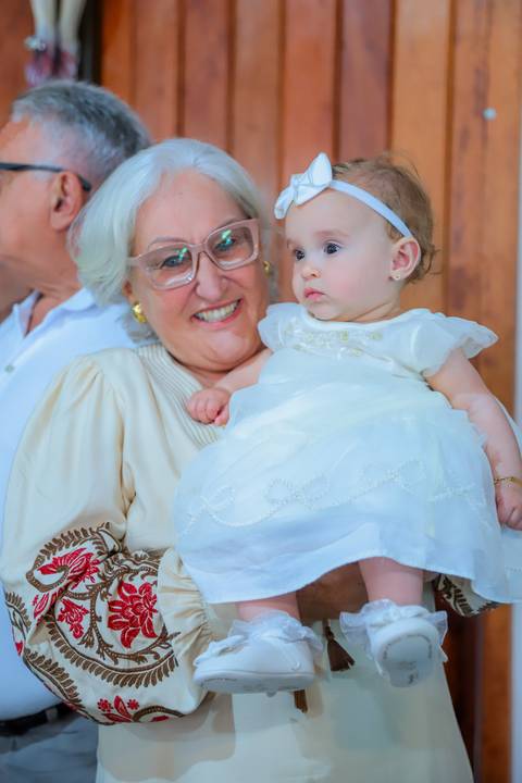 Turistas do Mato Grosso do Sul celebram batismo da filha em Praia do Forte com fotos profissionais durante estadia no Iberostar Bahia.'