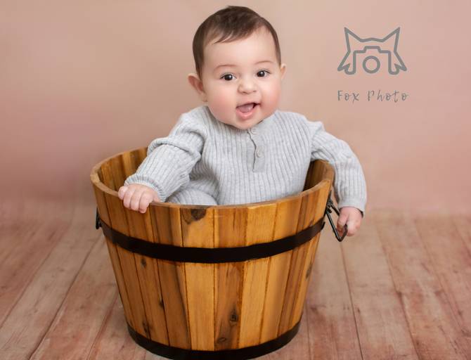 Brown background wih wooden bucket