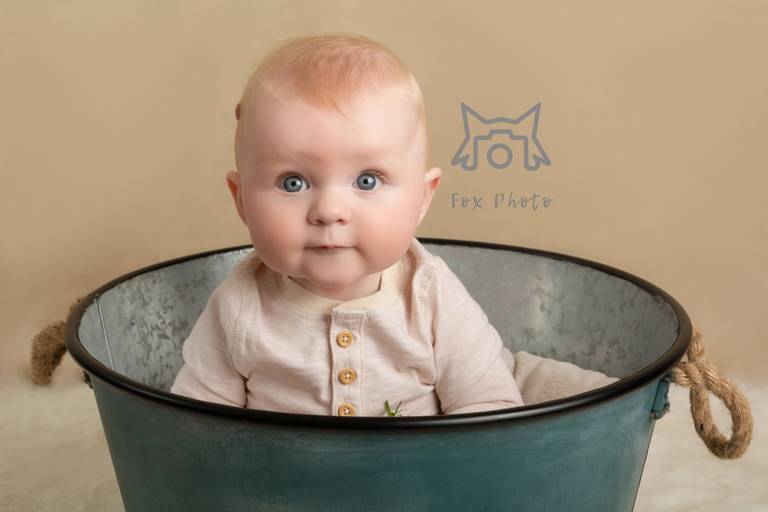 Brown background with metal bucket