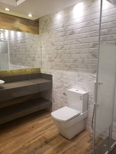 Instalação de piso e revestimento em porcelanato, instalação de bancada para lavatório