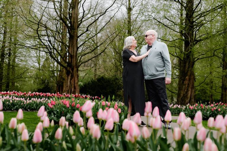 Senior couple photographed at Keukenhof Gardens during tulip season, an accessible and scenic shore excursion for river cruise passengers in the Netherlands