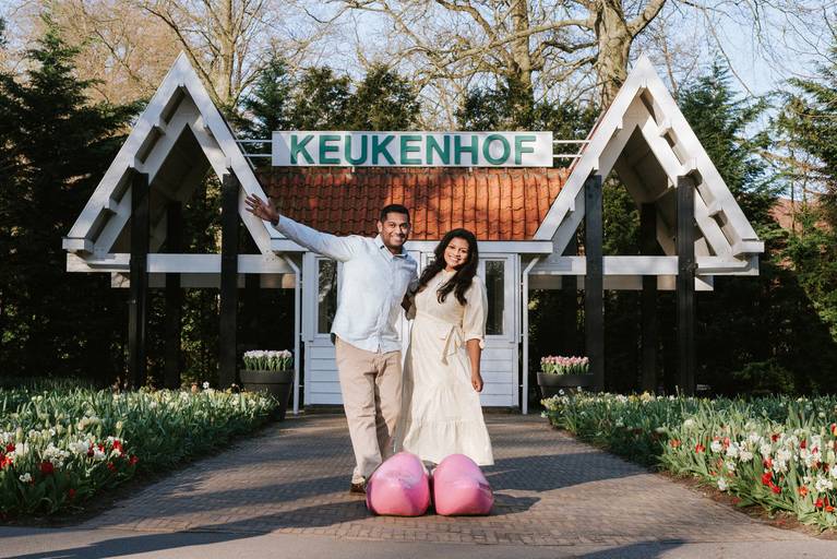 Couple at the Keukenhof Gardens entrance near Amsterdam, enjoying a spring tulip-season photoshoot ideal for river cruise excursions.