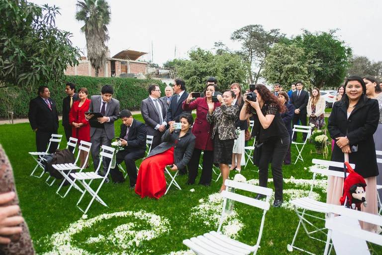 Doing images before the wedding ceremony starts. Open wedding and few guests during this summer day. 