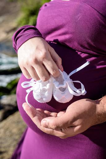 Sapatinhos branco do bebê